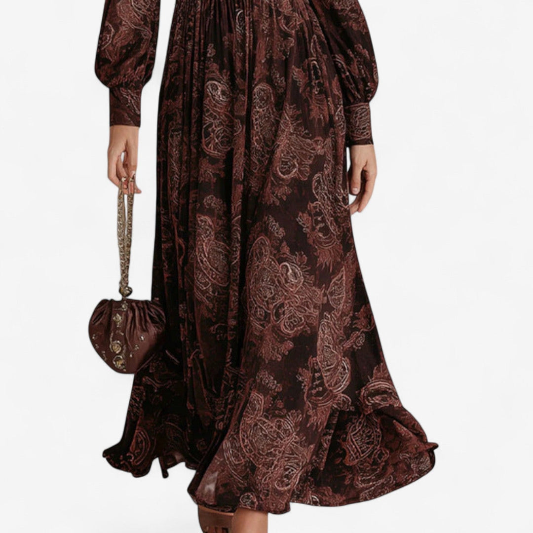 Brown paisley print maxi dress showing the gathered skirt, side view