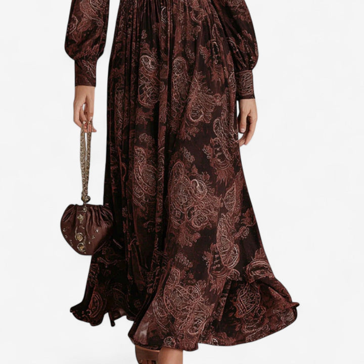 Brown paisley print maxi dress showing the gathered skirt, side view
