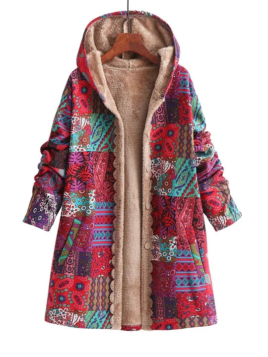 Orange patchwork print hooded jacket with sherpa lining on a hanger