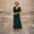 Dark green pleated wrap midi dress with short sleeves, front view