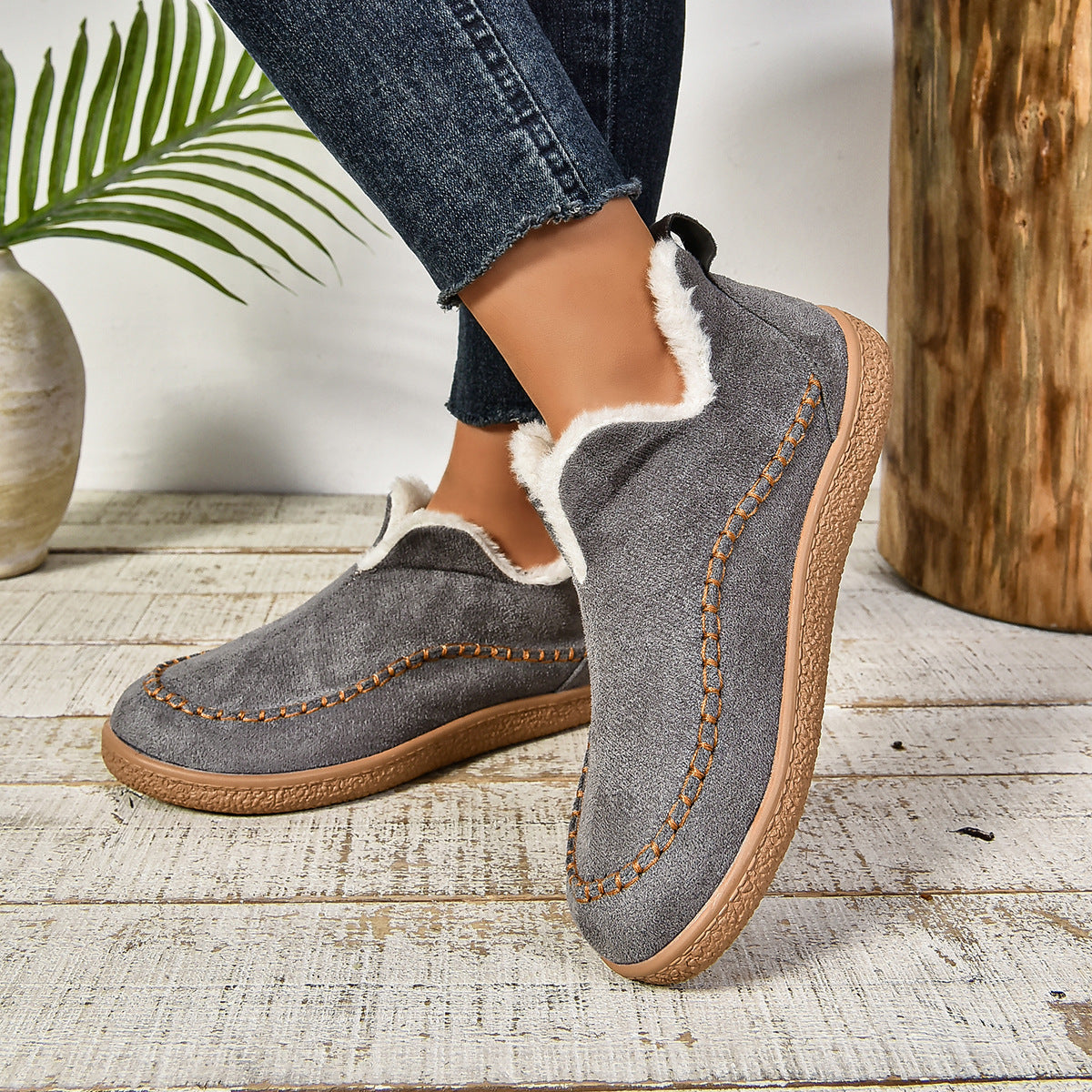 Gray plush lined slip-on boots with contrast moc stitching