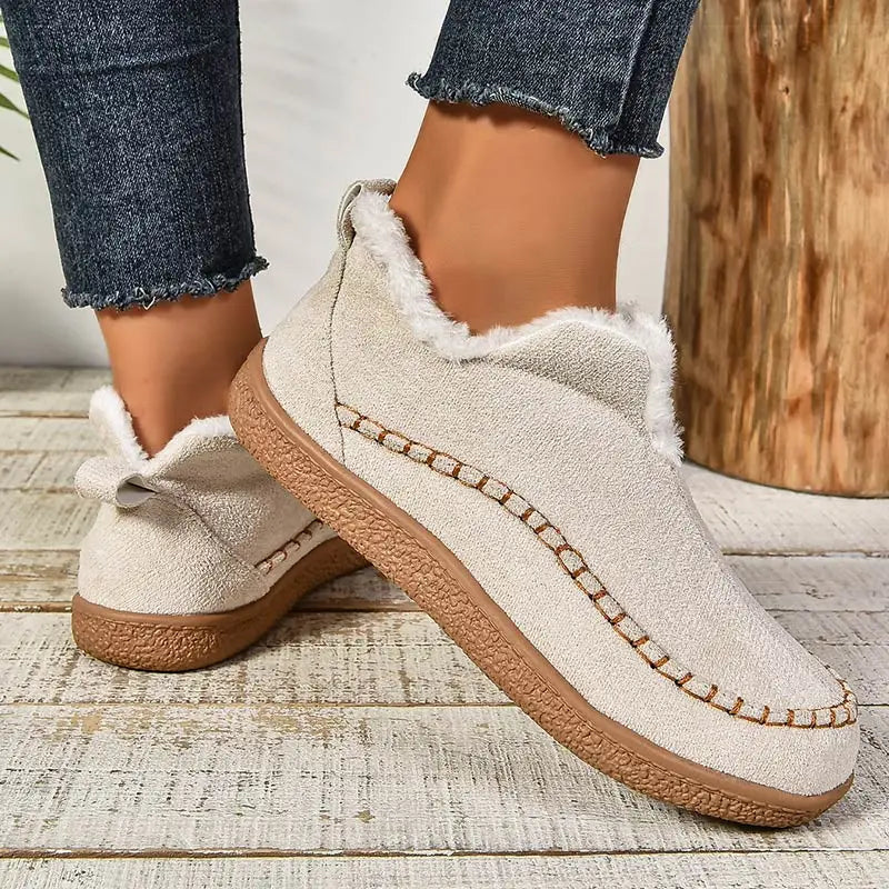 Oatmeal plush lined slip-on boots, side view with the heel pull tab