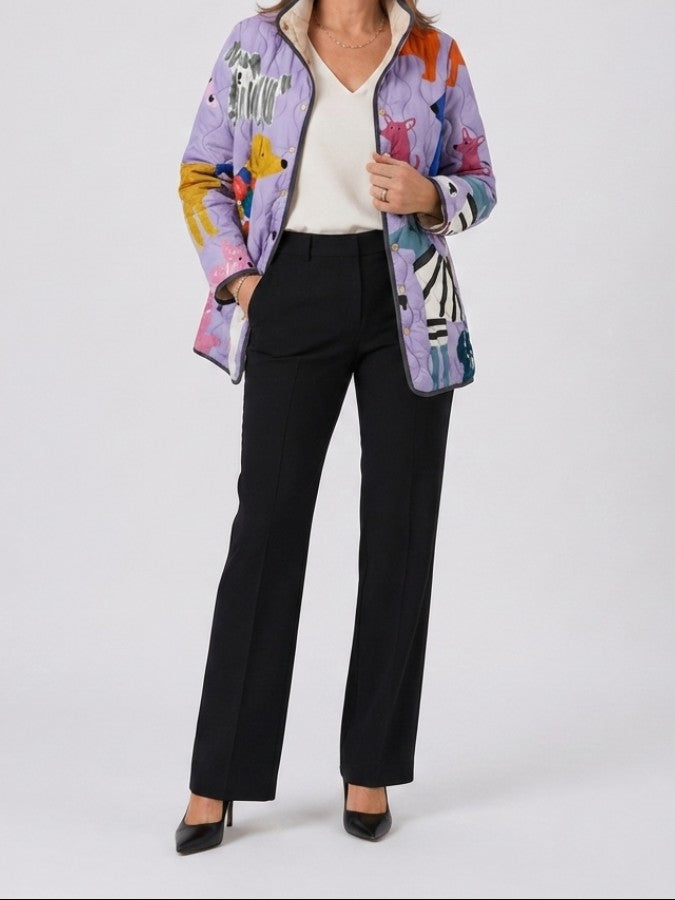 Lilac quilted dog print jacket worn with a white top and black pants