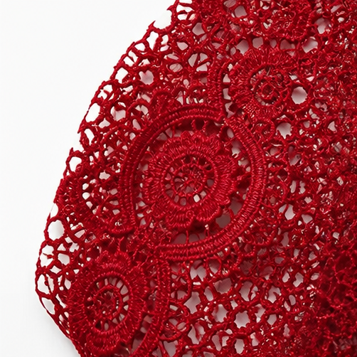 Close-up of the red floral crochet lace used on the sleeves