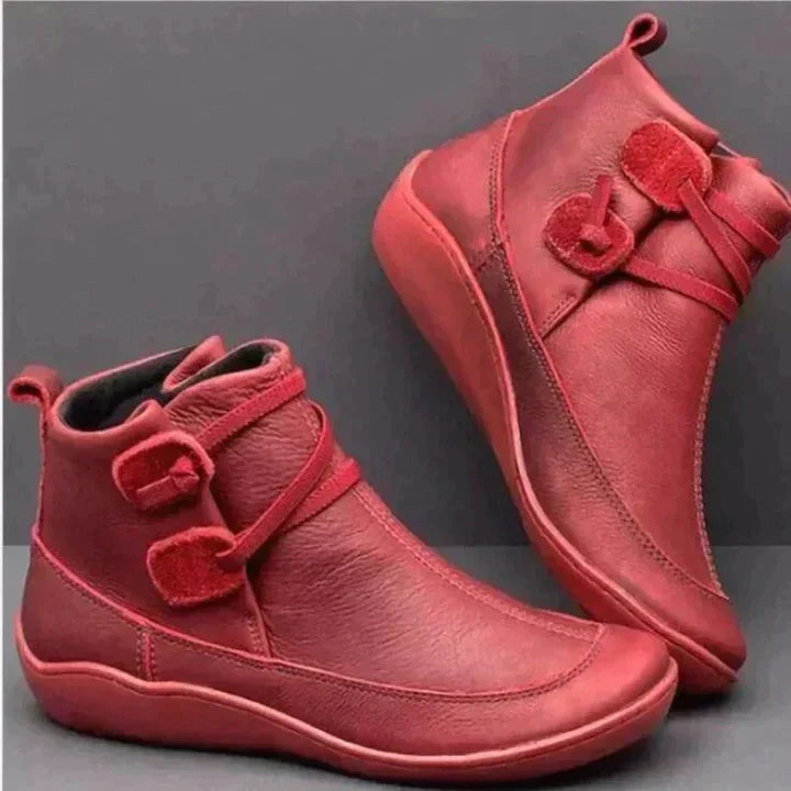Red side lace ankle boots with the buckle tabs in view
