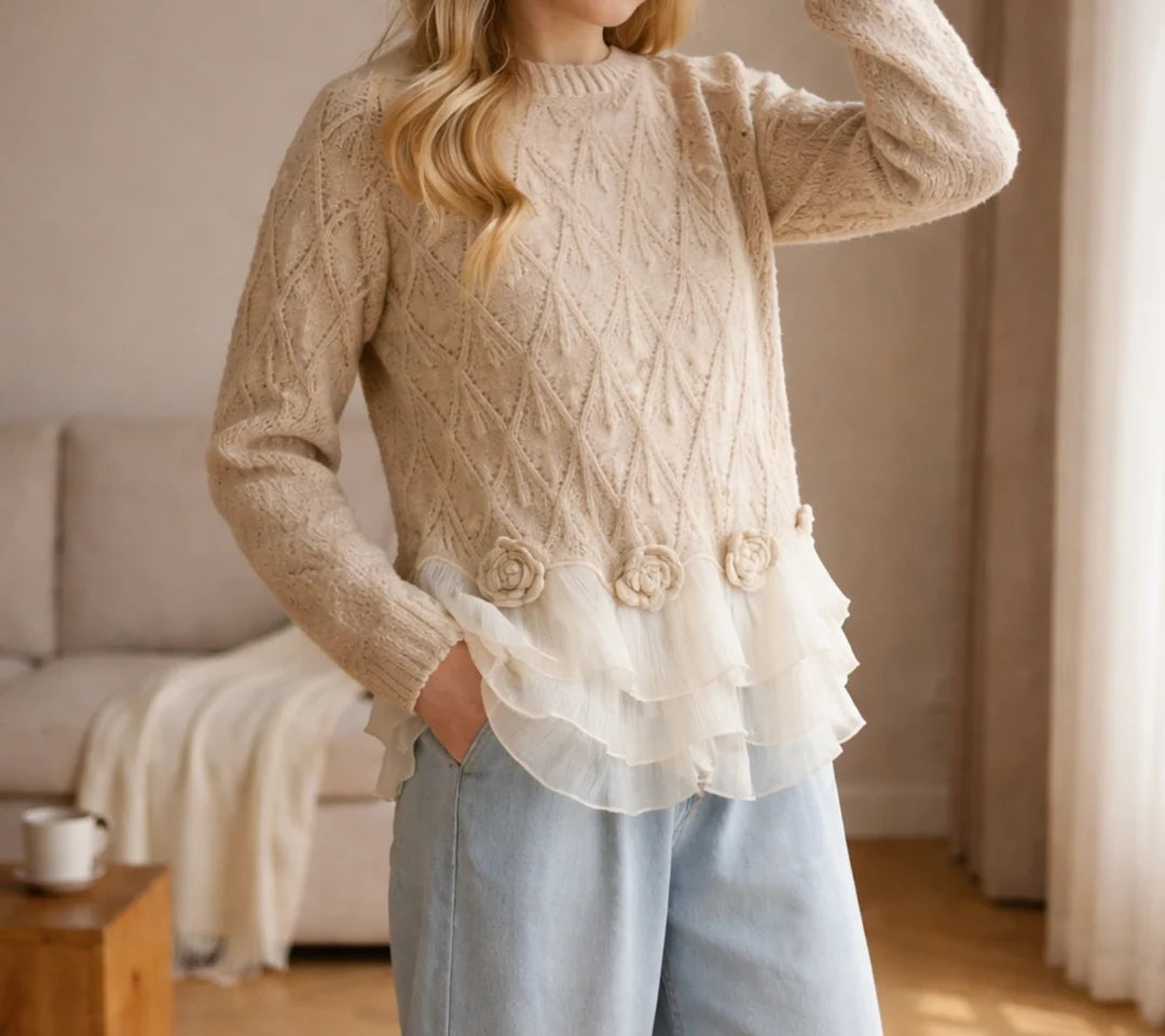 Oatmeal pointelle sweater worn with light jeans, front view