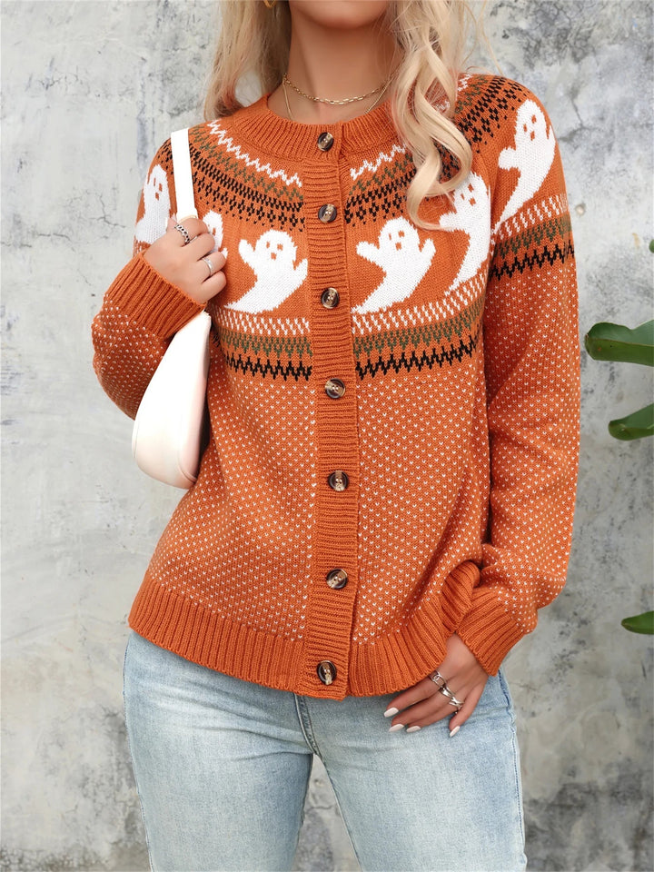 Rust orange button cardigan with a white ghost and fair isle yoke pattern