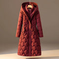 Rust red honeycomb quilted hooded coat shown from the front on a hanger