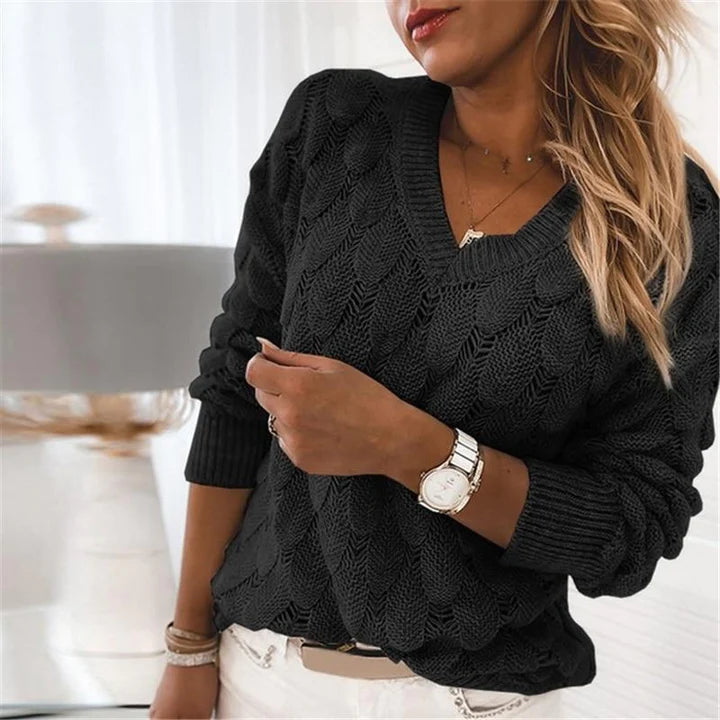Black scalloped pointelle knit V-neck sweater with ribbed V neckline, front view