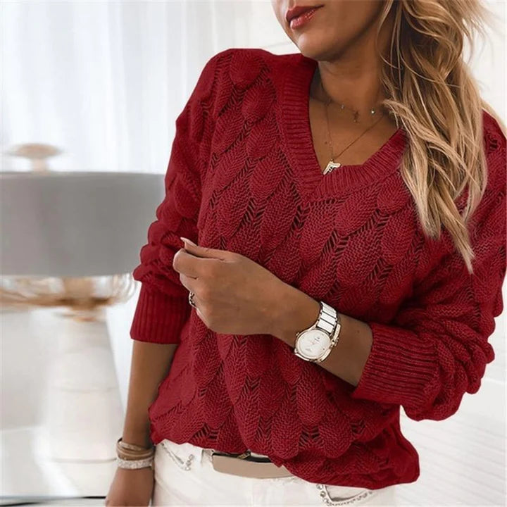 Red scalloped pointelle knit V-neck sweater with bobble shoulders, front view