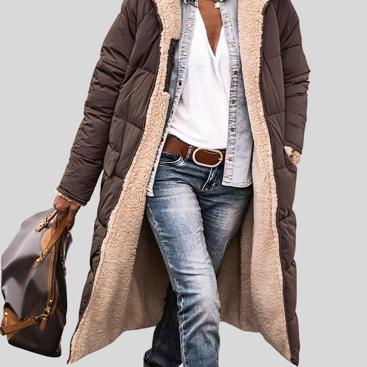Brown longline quilted coat worn open to show the cream sherpa lining