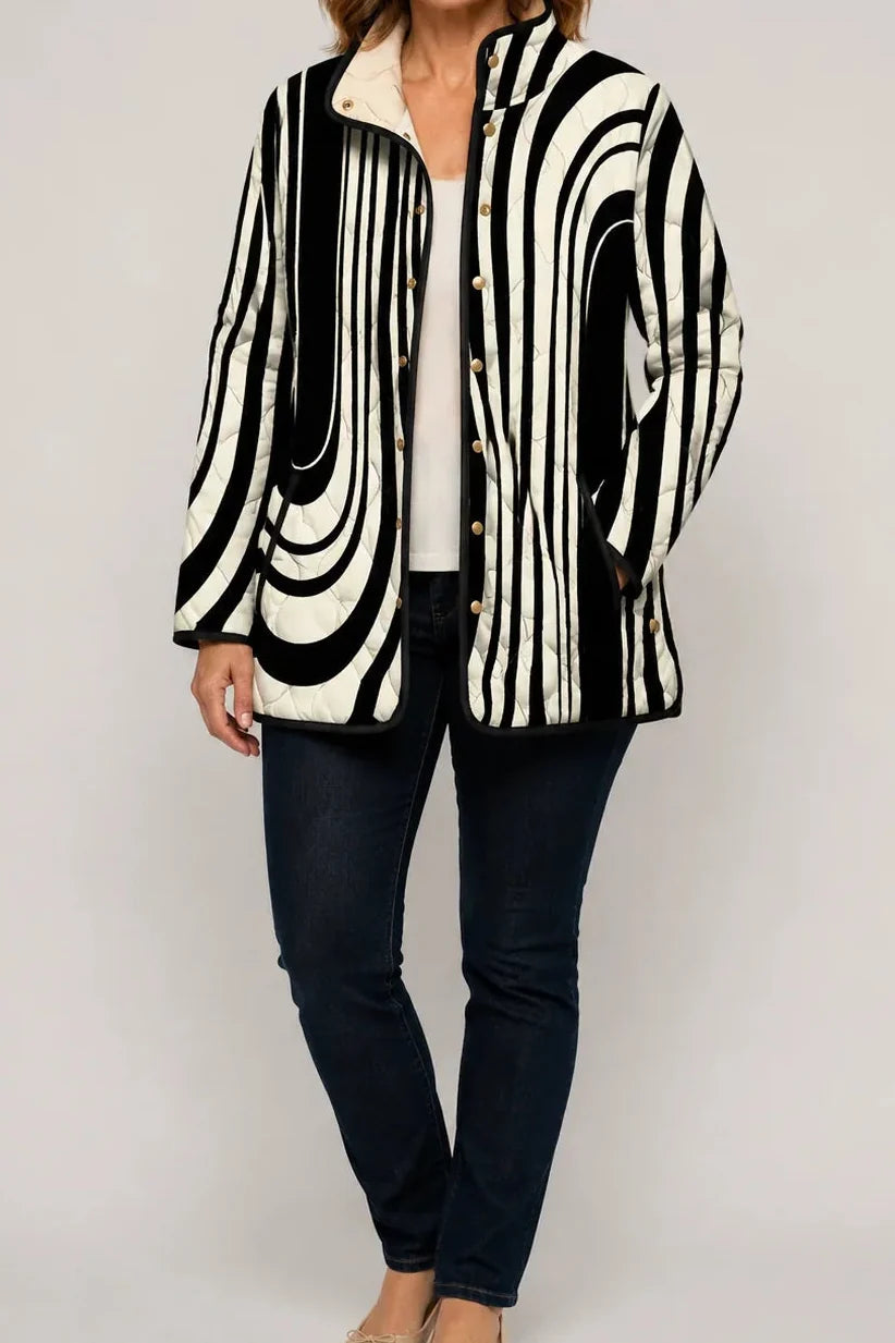 Black and white swirl print quilted jacket with a sherpa collar