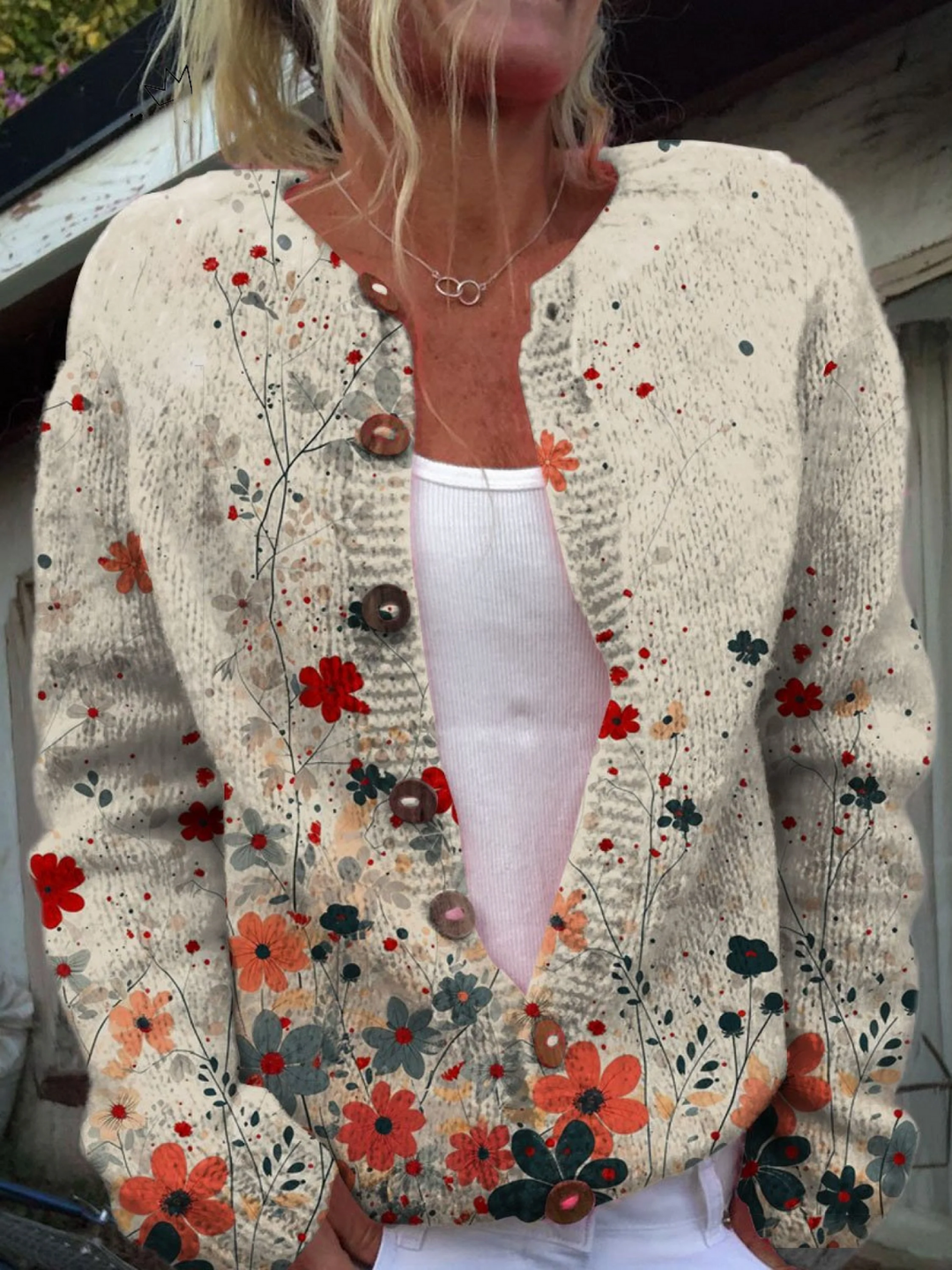 Cream knit button cardigan with a red and teal wildflower print