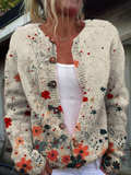 Cream knit button cardigan with a red and teal wildflower print