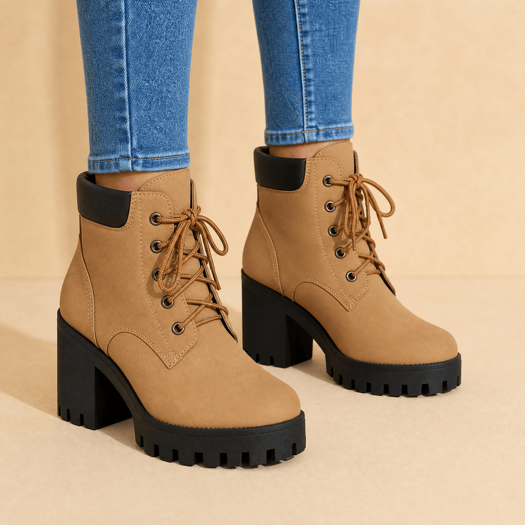 Camel lace-up platform boots with black lug soles worn with blue jeans