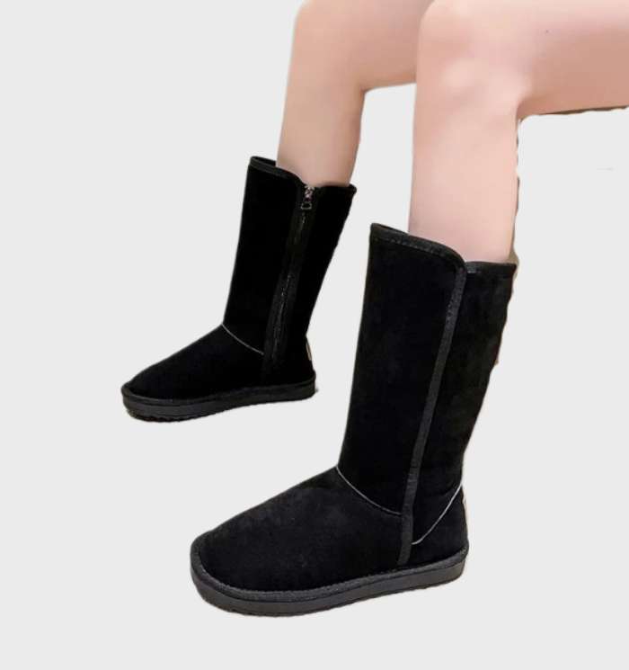 Black tall fleece lined boots worn seated