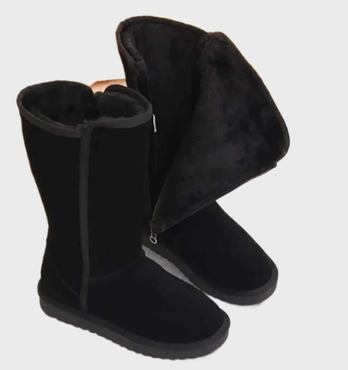 Black tall fleece lined boots with the fleece cuff folded out