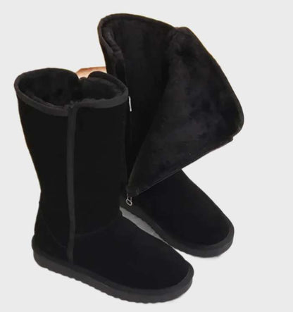 Black tall fleece lined boots with the fleece cuff folded out