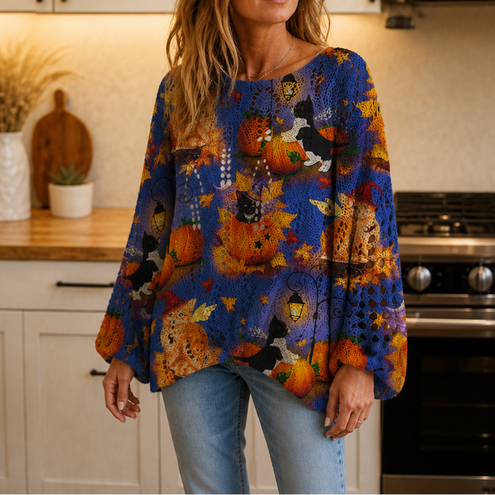 Blue long sleeve top with an all over print of pumpkins, cats and autumn leaves