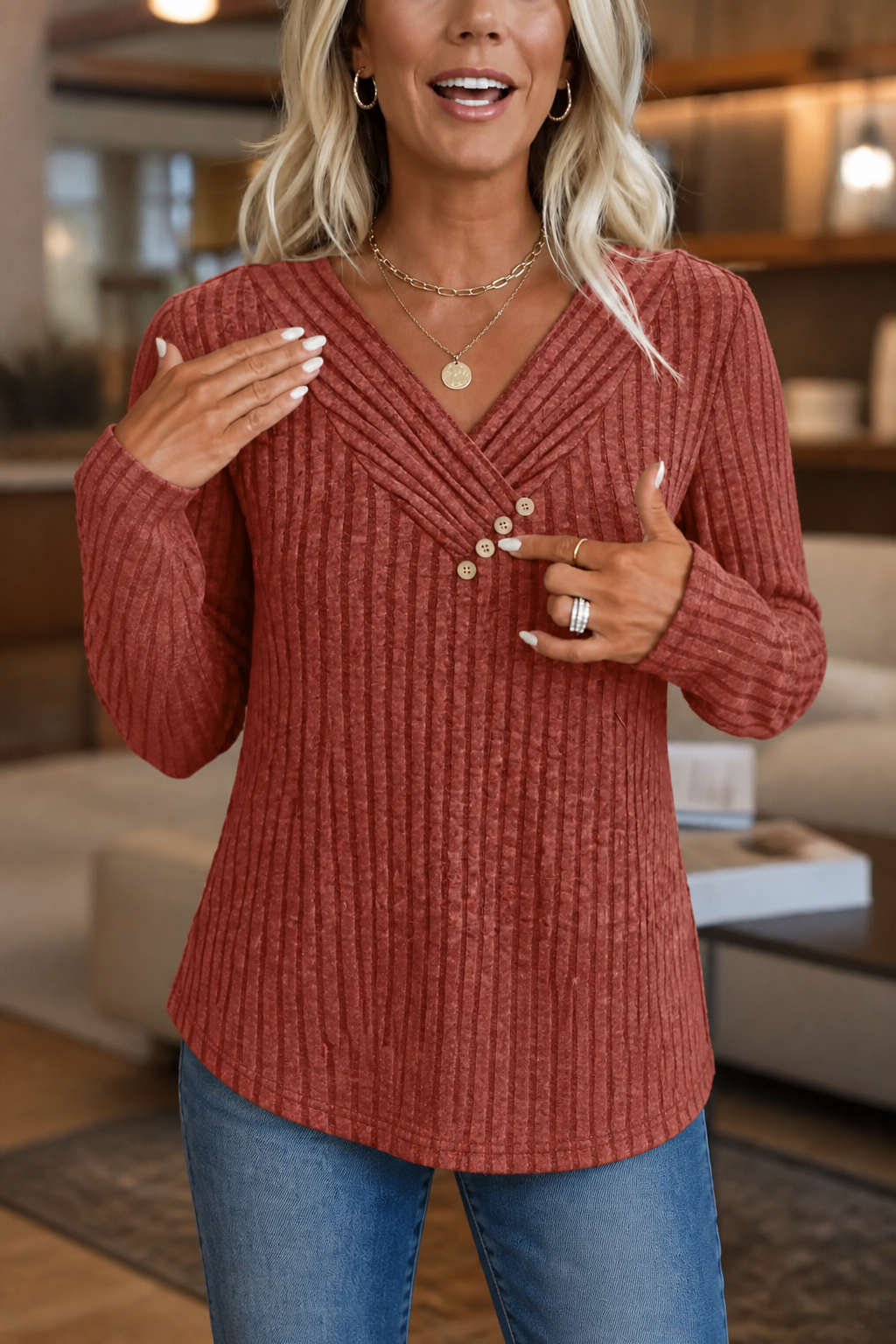 Rust ribbed knit top with pleated V neck and three wooden buttons, worn with blue jeans