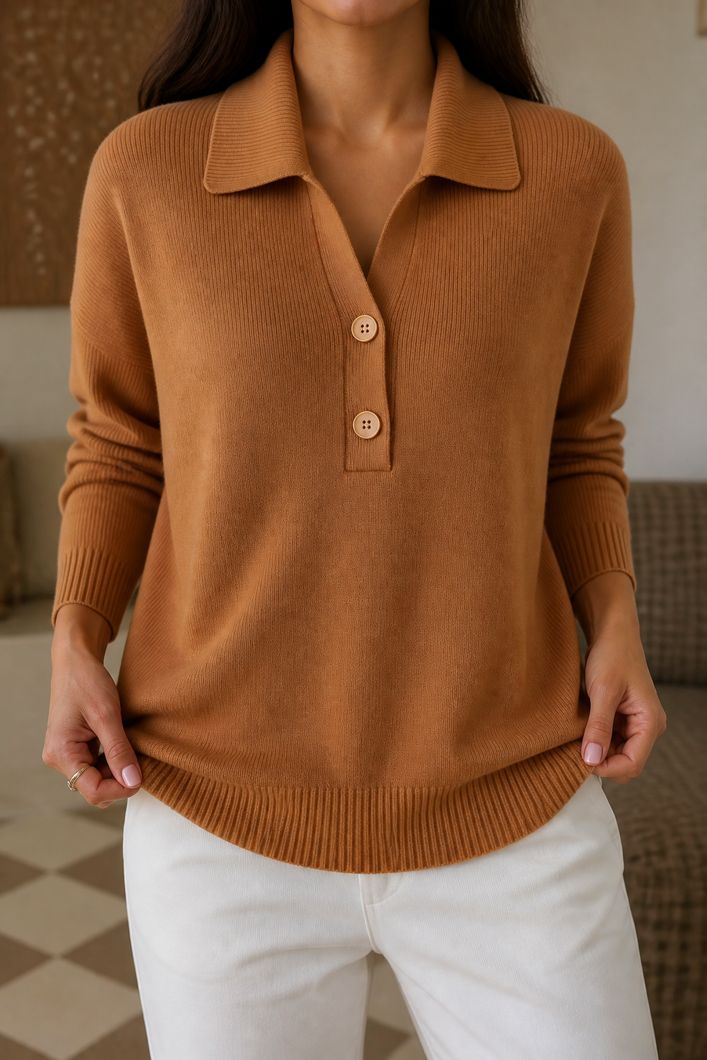 Camel polo collar sweater with buttoned placket and ribbed hem, styled with white wide leg jeans