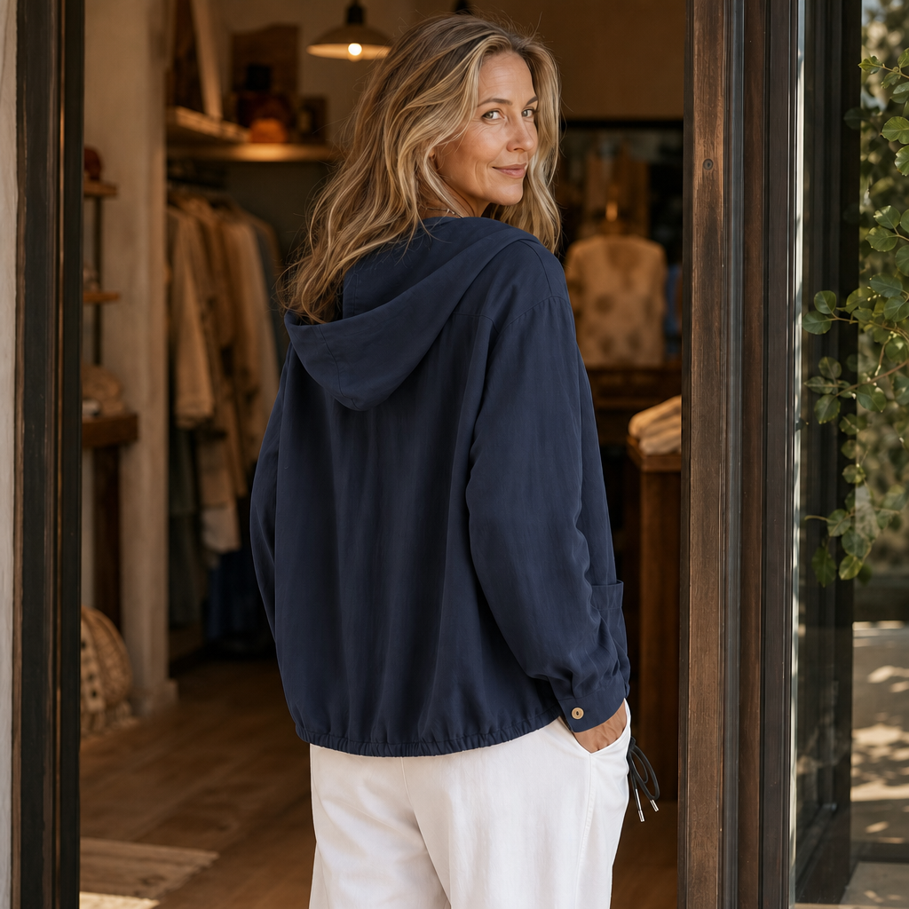 Back view of a navy hooded jacket with the hood down