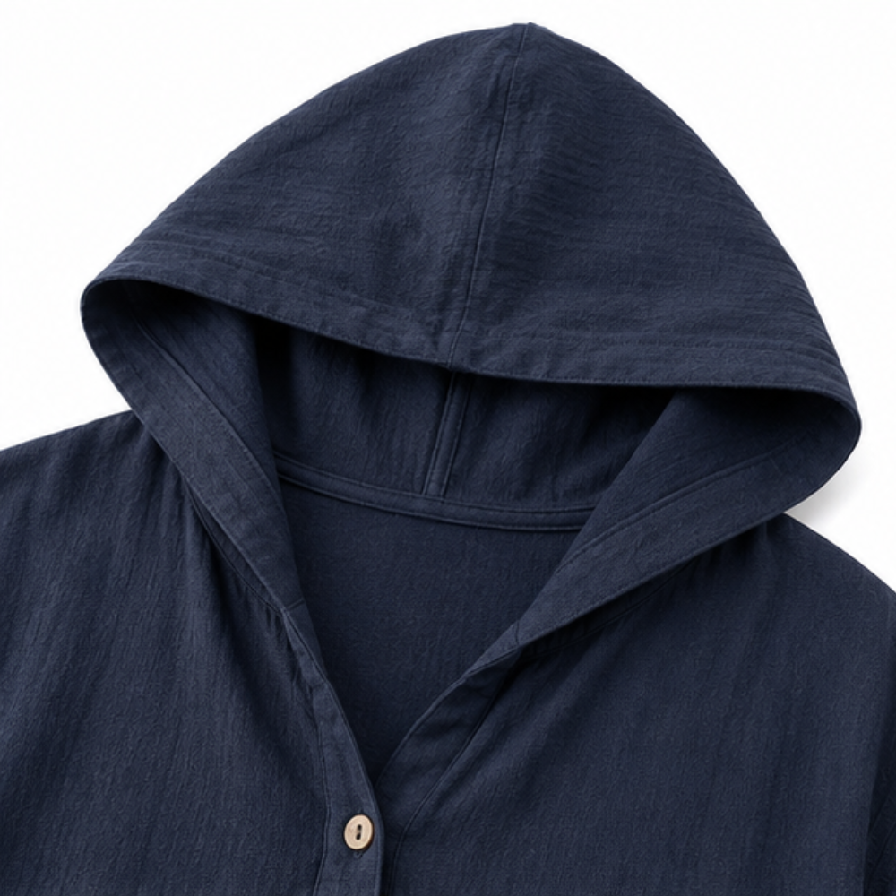Close up of the hood and wooden button on a navy jacket