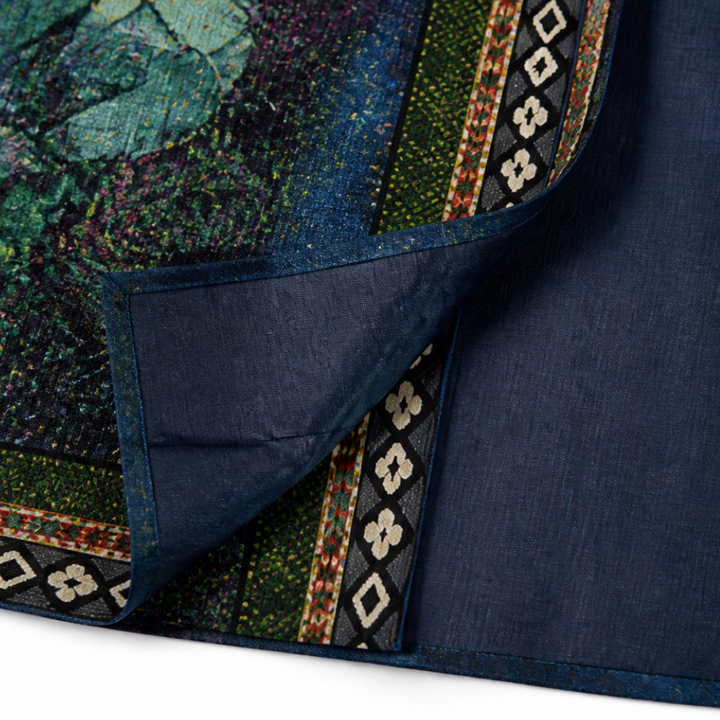 Hem corner turned back to show the navy lining on an art print jacket