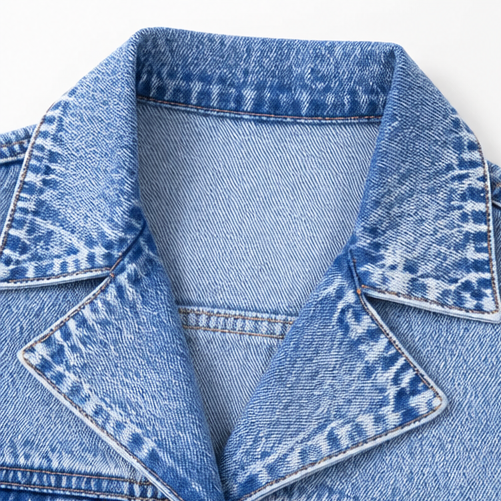 Close up of the notch collar on a light wash denim vest