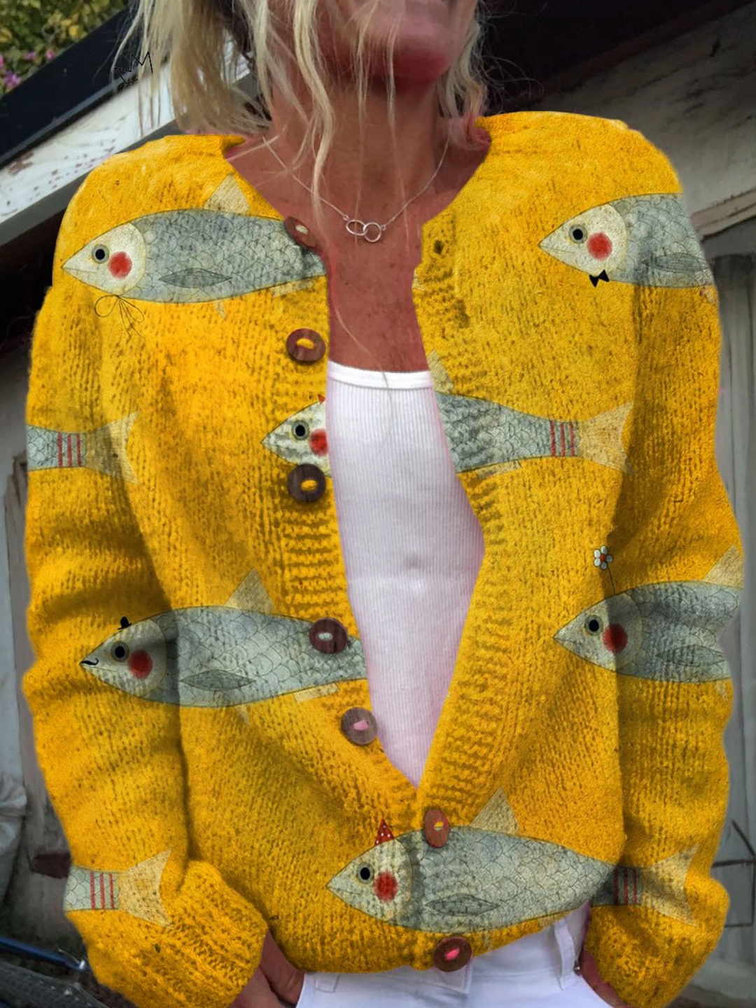 Yellow knit button front cardigan with a printed fish design
