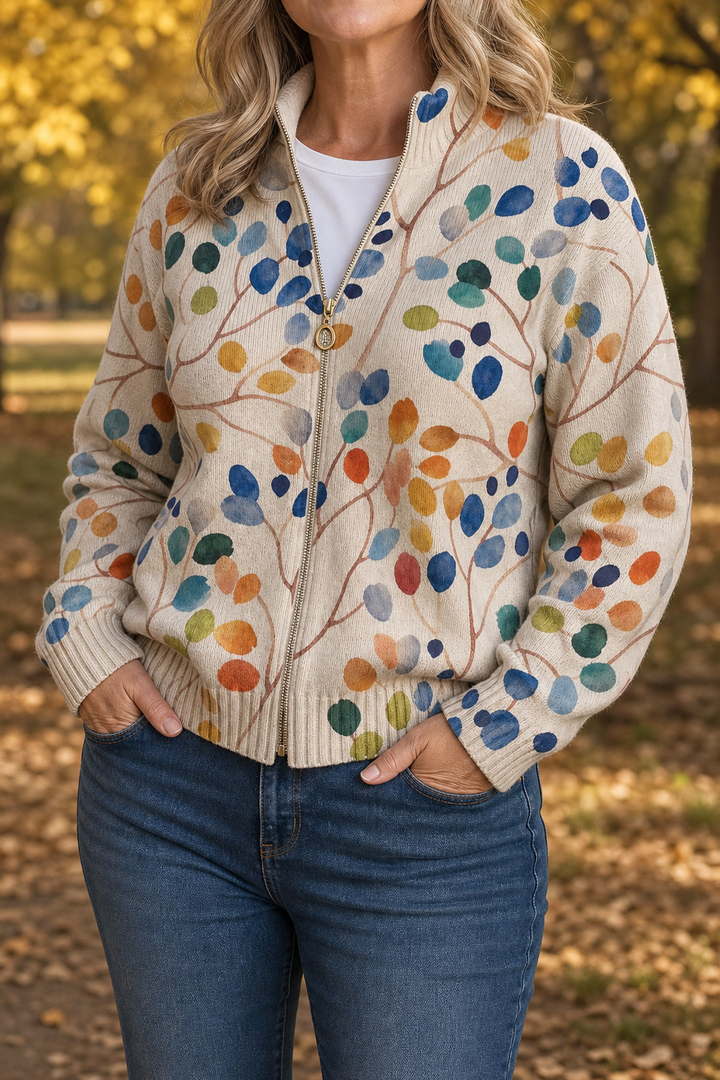 Cream berry branch print bomber worn with jeans in autumn