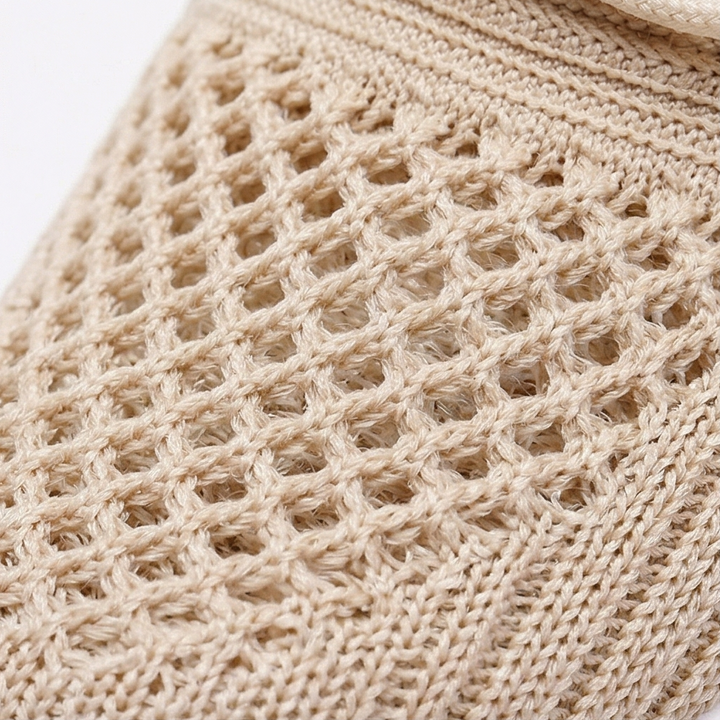 Close-up of the open beige knit weave on the sneaker upper