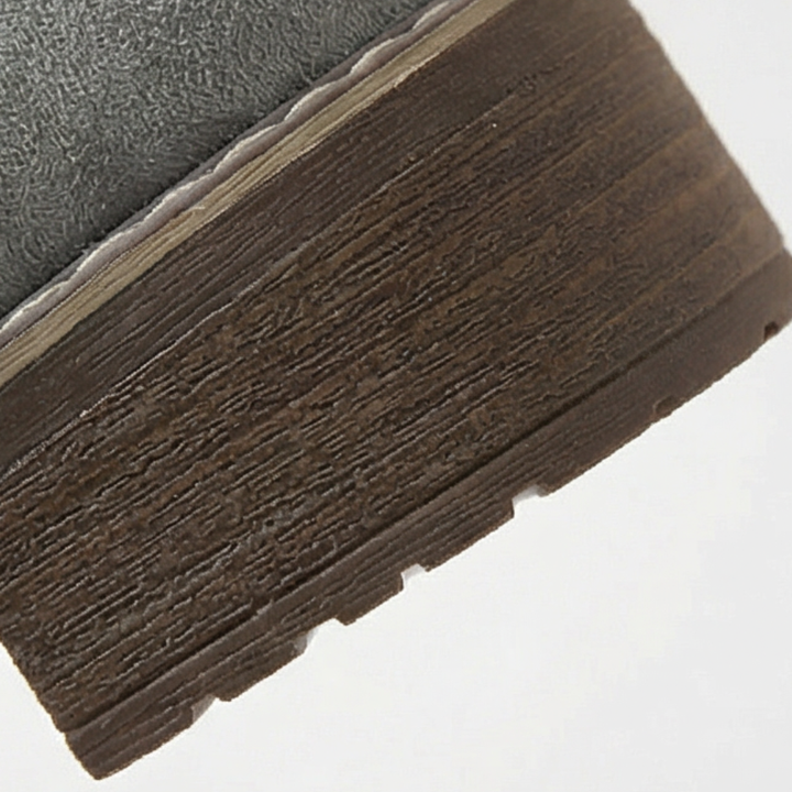 Close up of the elastic side gusset on a grey ankle bootie