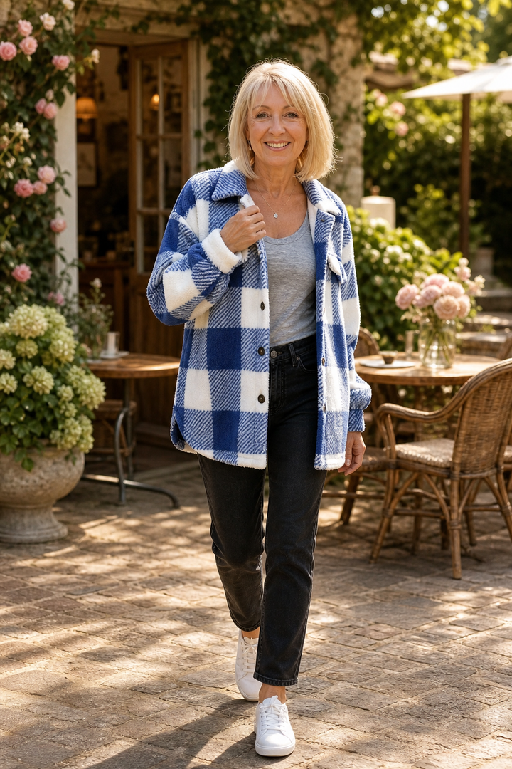 Woman on a garden terrace in a blue buffalo check sherpa overshirt