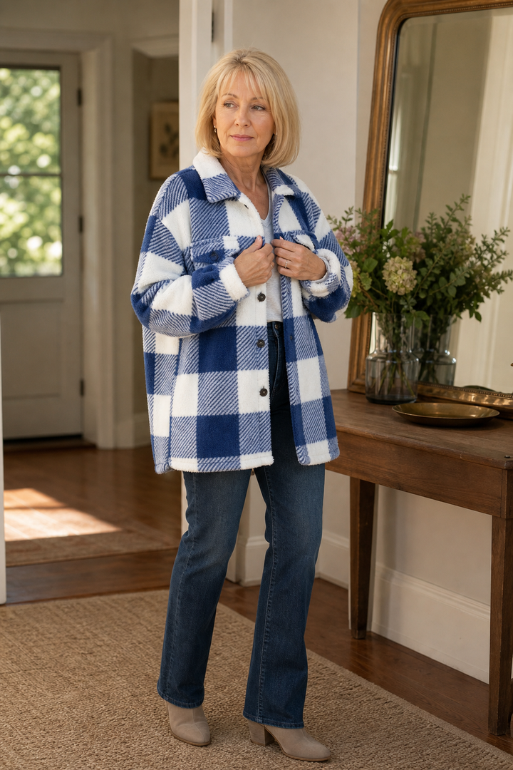 Blue buffalo check sherpa overshirt seen in a hallway mirror