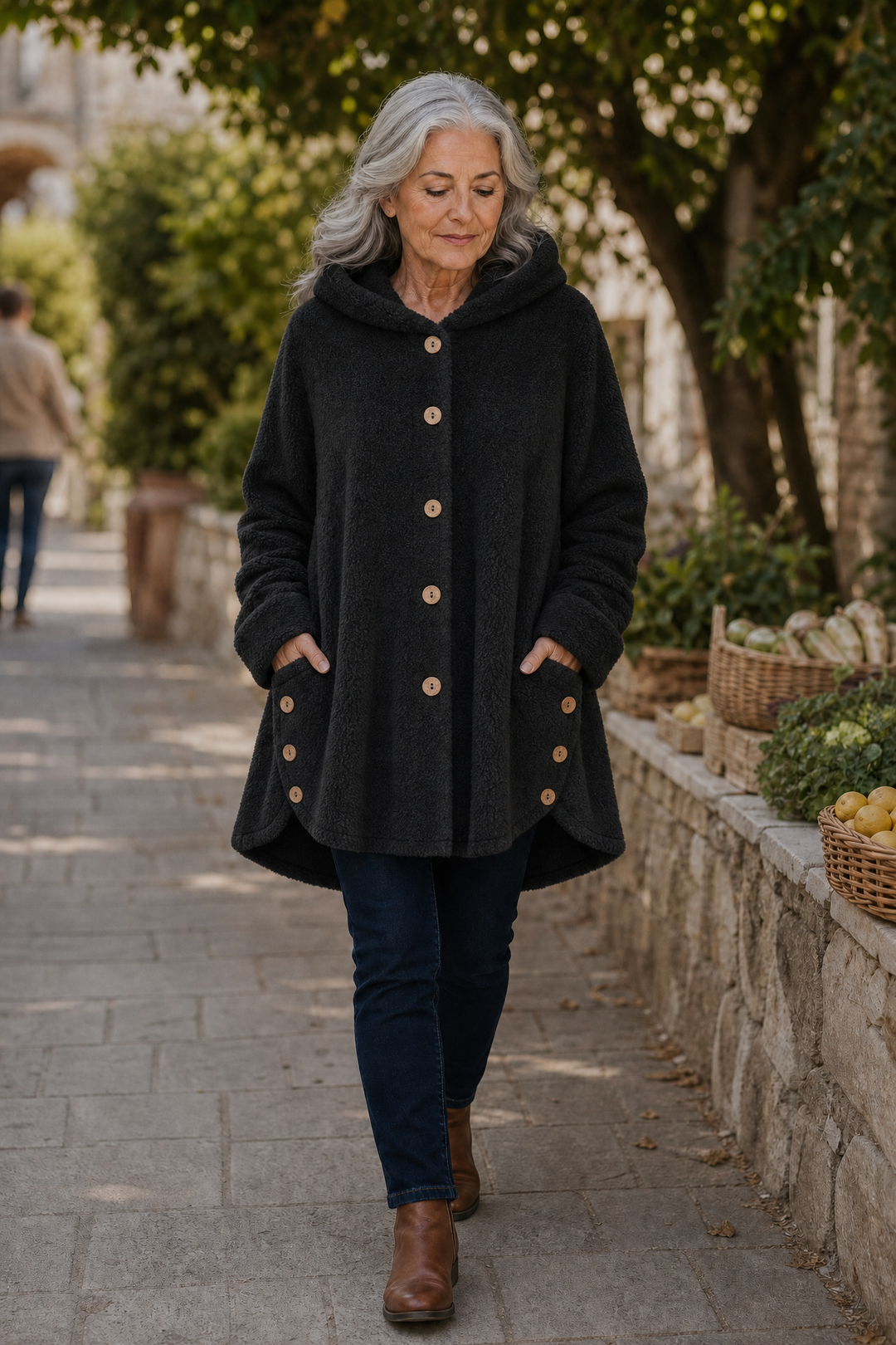 Woman on a stone lane in a black hooded fleece shirt jacket