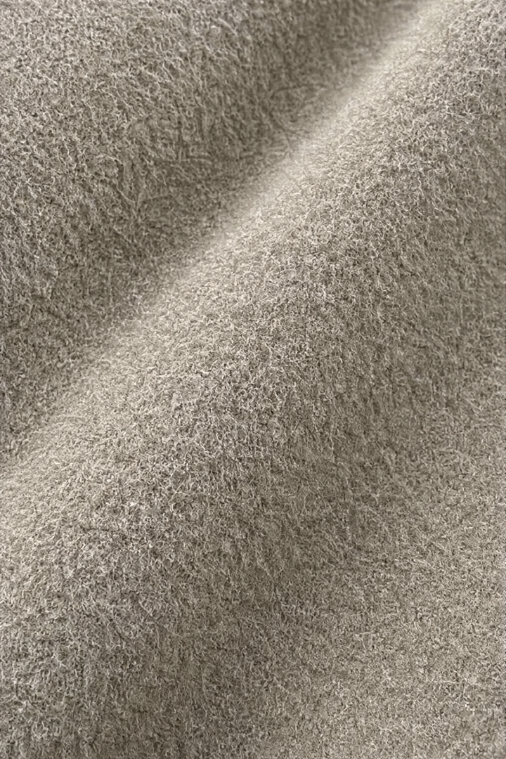 Close up of the brushed taupe wool blend coat fabric