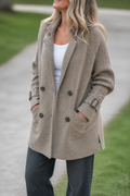 Taupe longline coat with cable knit sleeves and buckle cuffs
