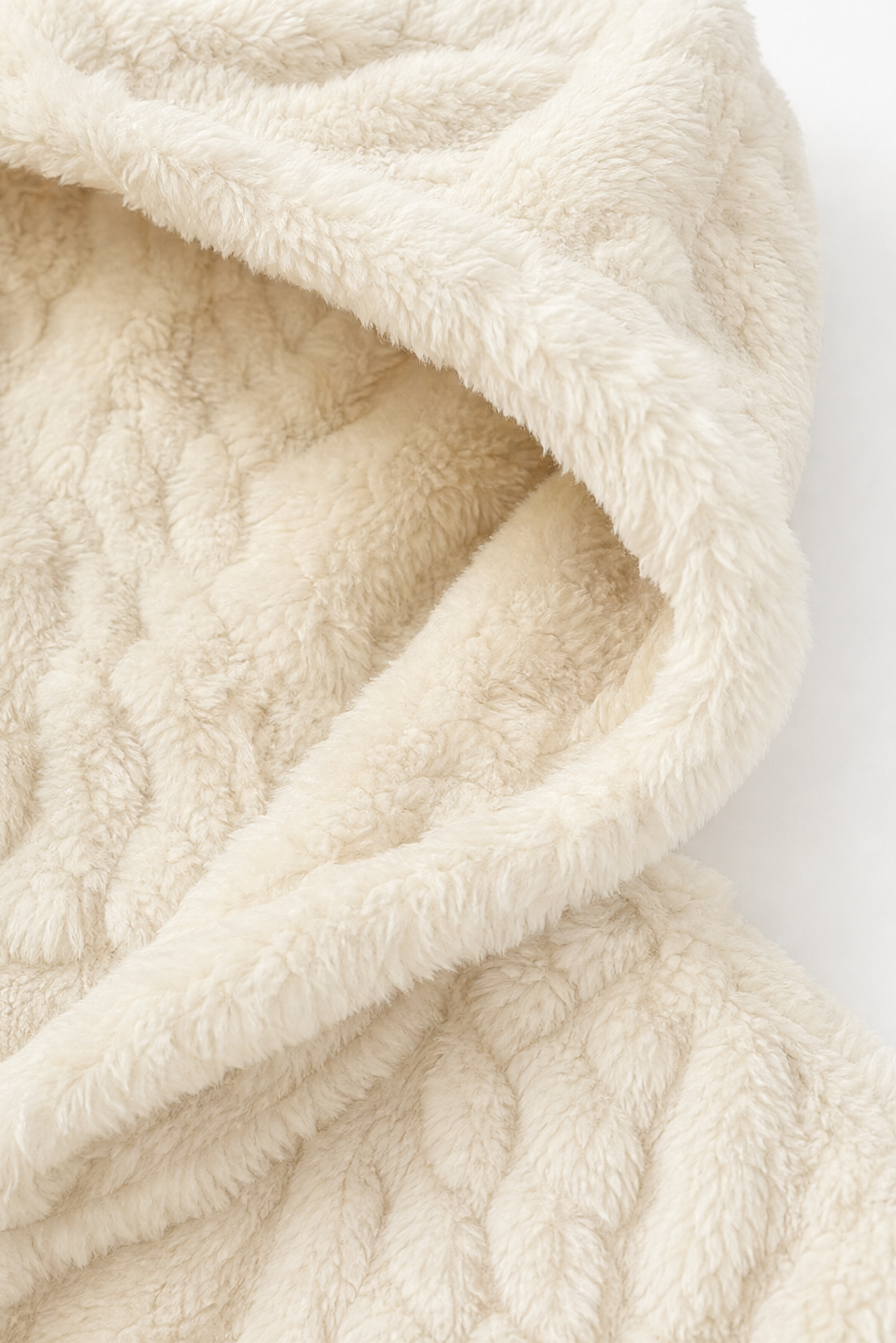 Soft cream fleece hood folded to show the plush pile