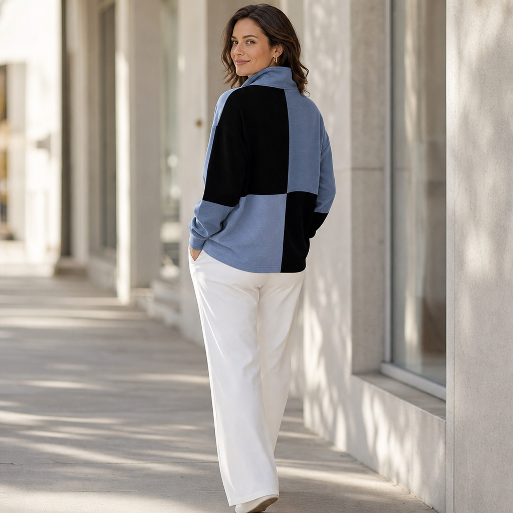Back view of a blue and black colorblock half zip sweatshirt