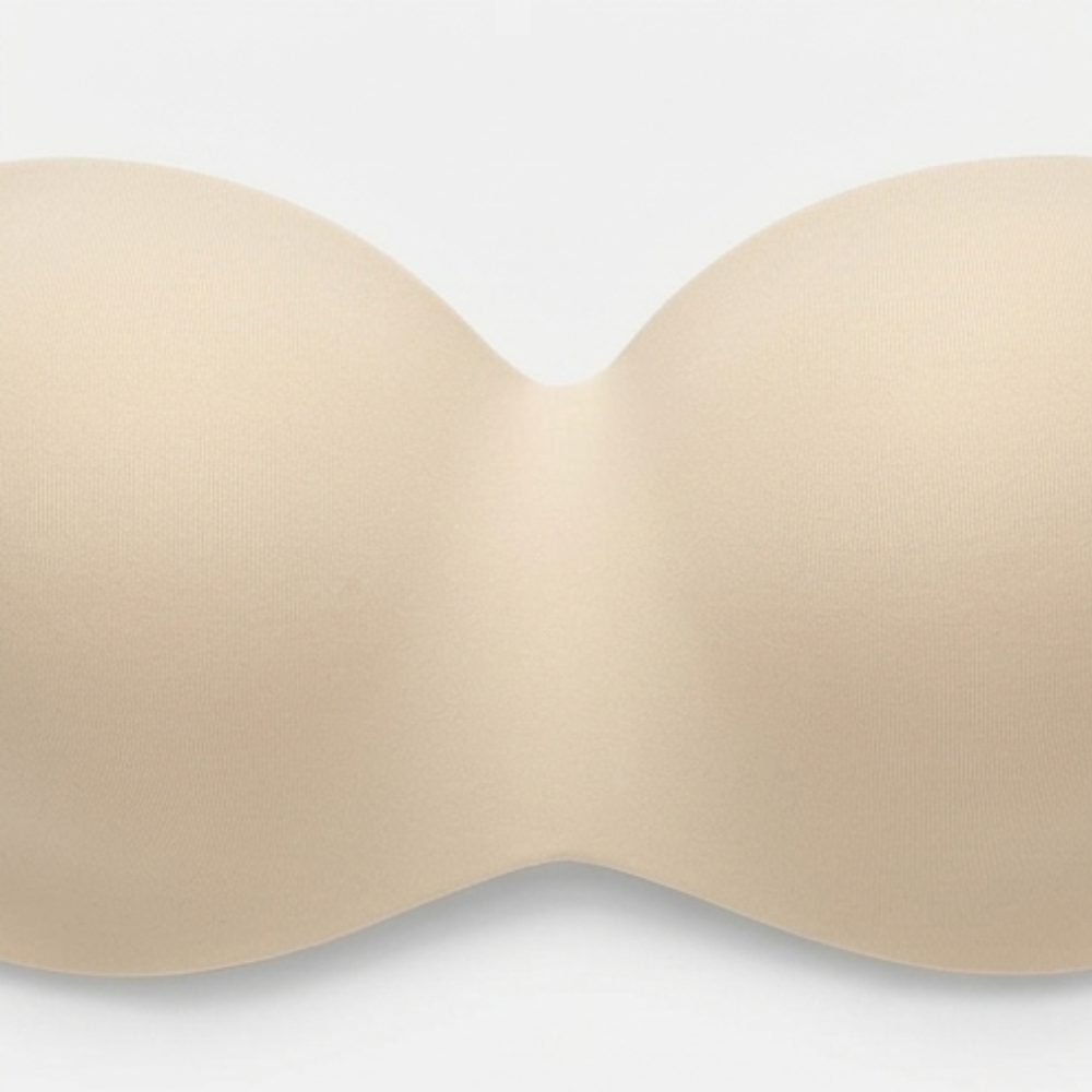 Close-up of the moulded cups on a nude strapless bra