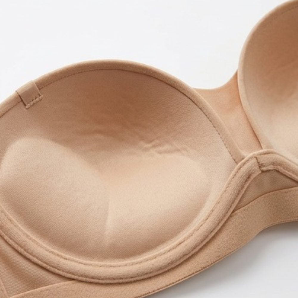 Inside of a nude strapless bra cup showing the moulded shape