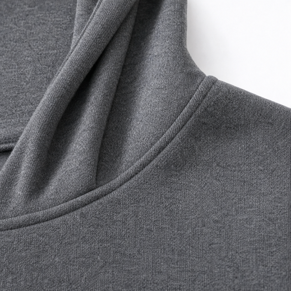 Close up of the draped hood on a grey travel coat