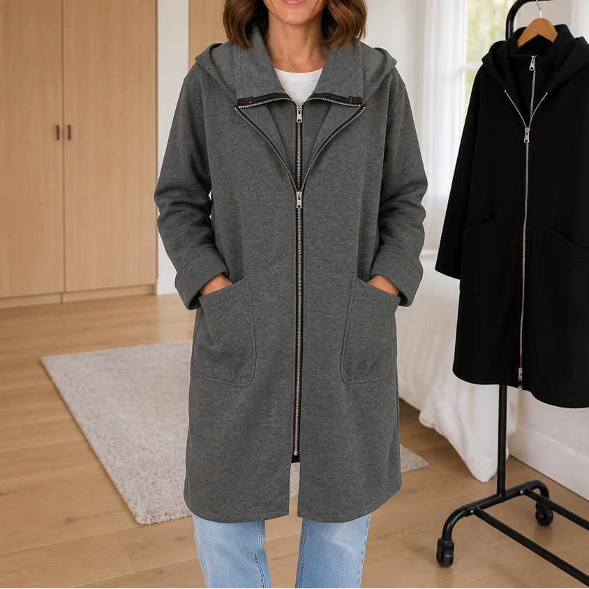 Grey hooded travel coat with an asymmetric zip and patch pockets