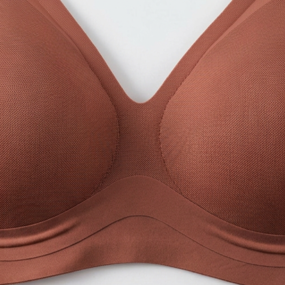 Close-up of the deep-V centre front on a rust wireless bra