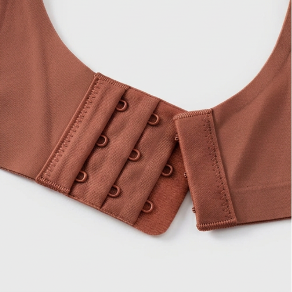 Close-up of the hook and eye band on a rust bra