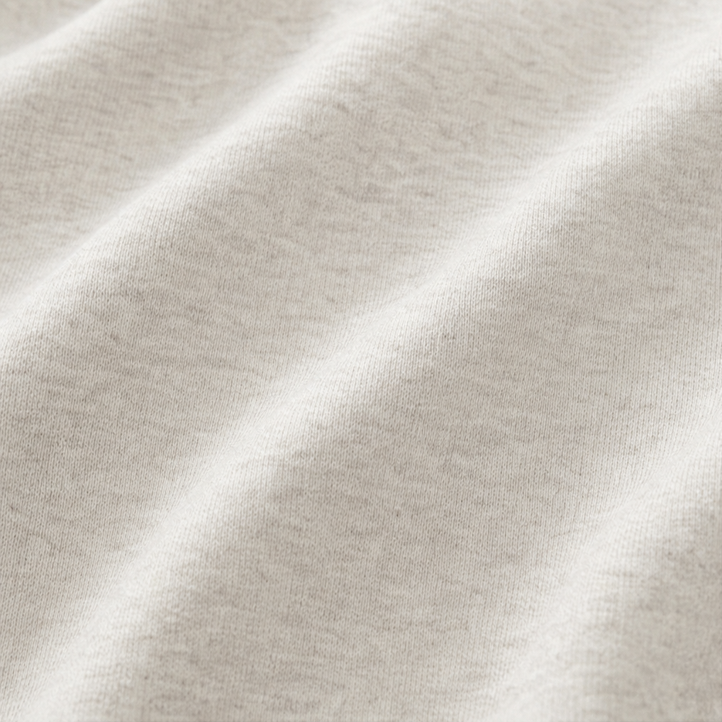 Close up of the soft brushed cream sweatshirt fabric