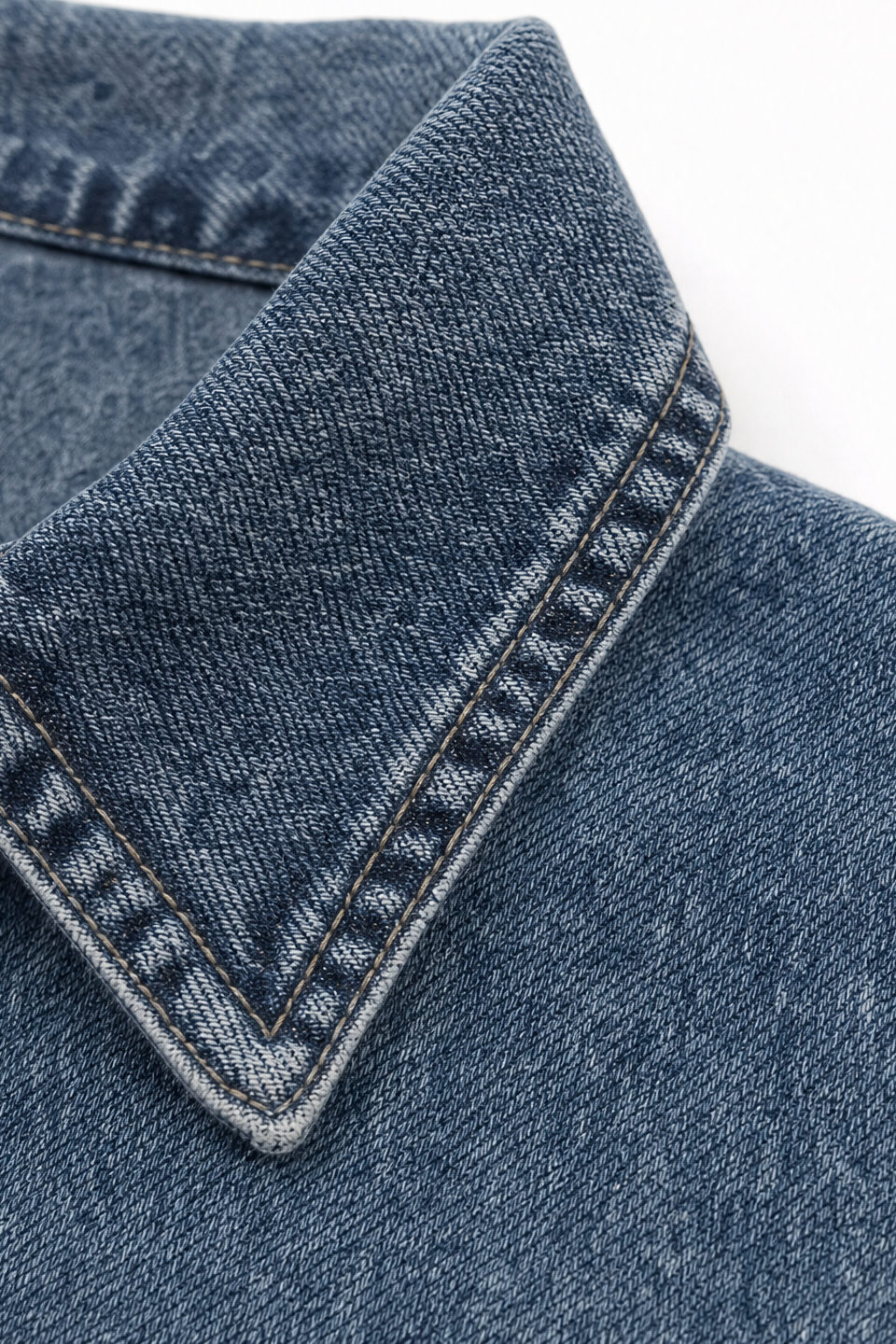 Ruffled collar detail on a blue denim jacket