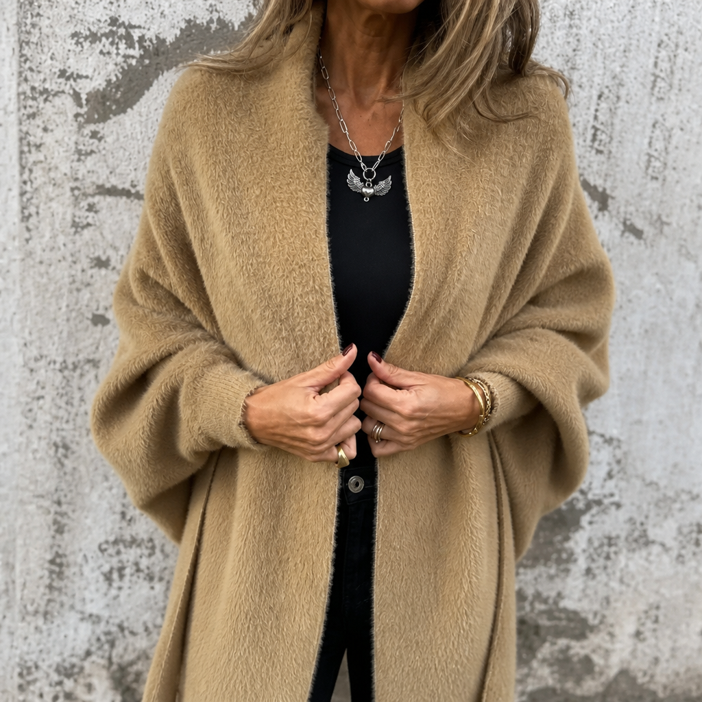 Camel draped shawl collar wrap worn over a black top