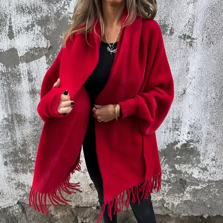 Red draped shawl collar wrap with a fringed hem